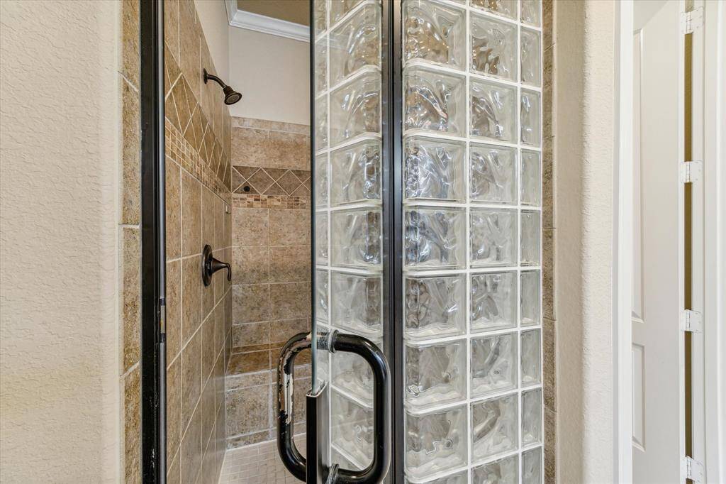 Separate walk-in shower in the primary bath.