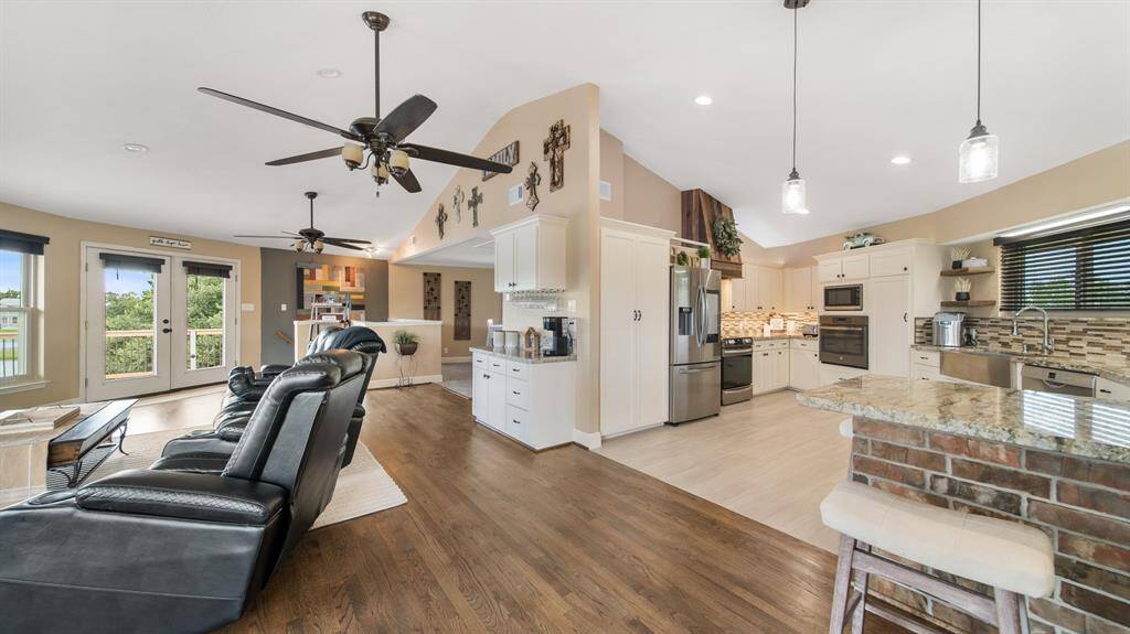 3rd Floor Open Concept Family, Dining & Kitchen Space takes advantage of the Bird's Eye View to the Awesome Lakes & Wildlife.  Don't be surprised with a visit from Deer, Birds, Geese, Ducks or Otters.