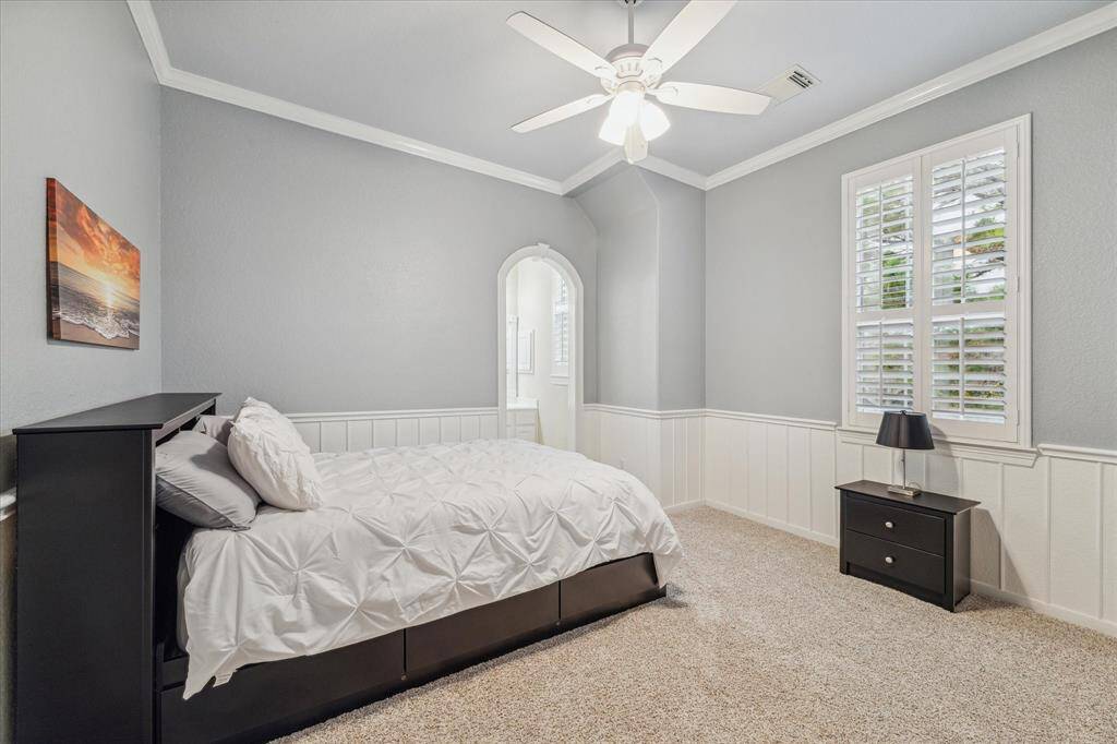 1st guest bed with elegant molding and en-suite bath.