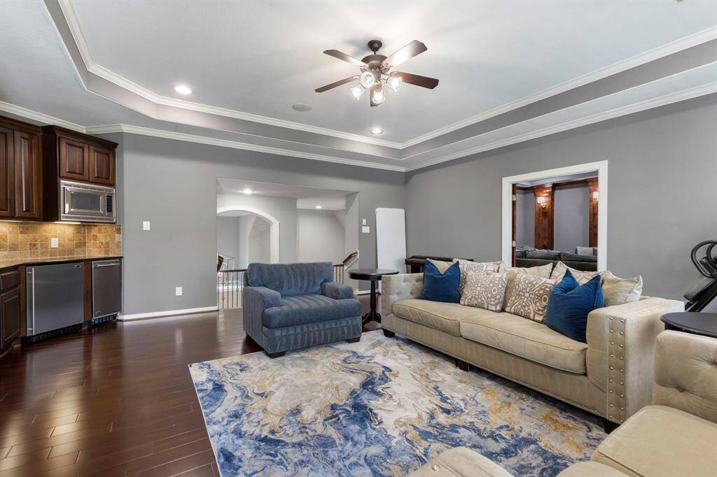 This spacious game room is perfect for entertaining guests or enjoying family time, with ample space for games, activities, and relaxation. The added bonus of surround sound enhances the experience.