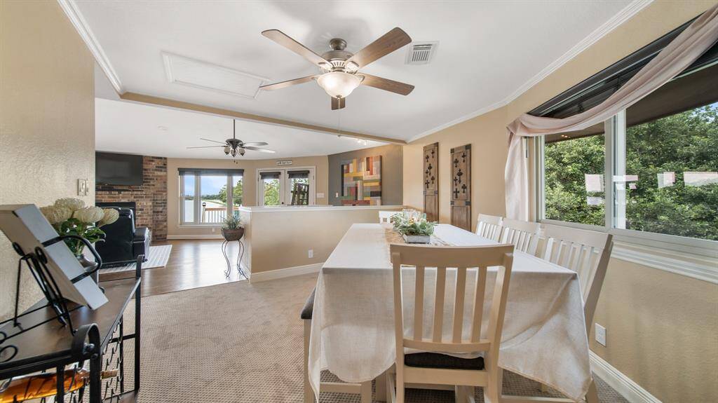 Formal Dining Area is Open to the Family Room. Nice Place to Host Dinner Parties with Stunning Sunset Lake Views on the 3rd Floor Top Deck.