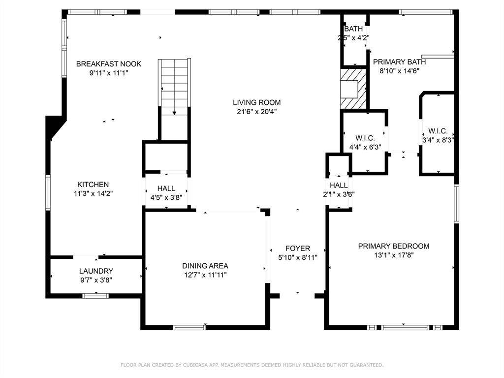 This floor plan features a spacious living room, primary bedroom with two walk-in closets and a primary bath, a kitchen with an adjacent breakfast nook, a dining area, and a laundry room. The layout includes a foyer and additional bath, providing a functional flow for comfortable living.