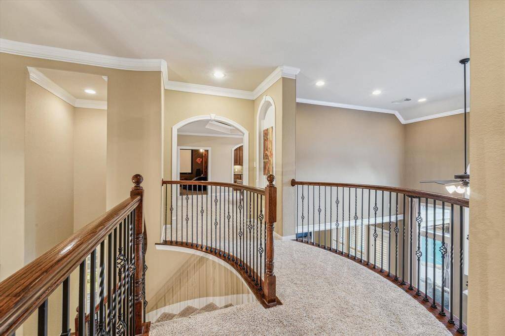 View from the top of the stairs looking into the gameroom area.