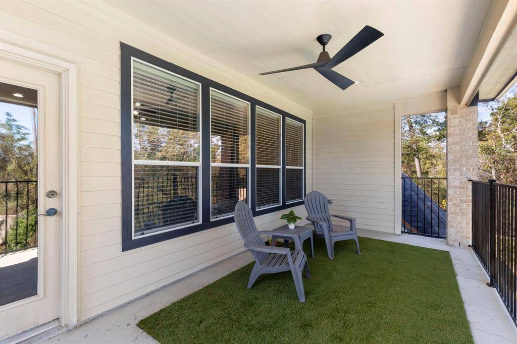 The balcony, located off the game room, offers the perfect spot to take in the stunning view of the beautiful backyard oasis or simply relax and enjoy a good book.