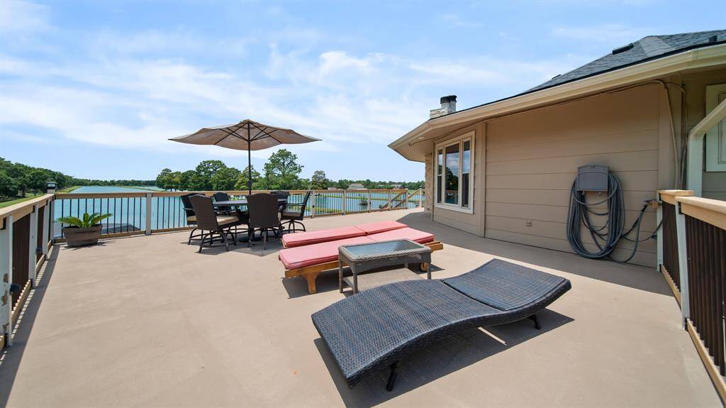 Opposite Side of the 3rd Floor Deck is right off the Kitchen & perfect for Outdoor Lunches & Lounging. Again that LAKE View will always be on point!