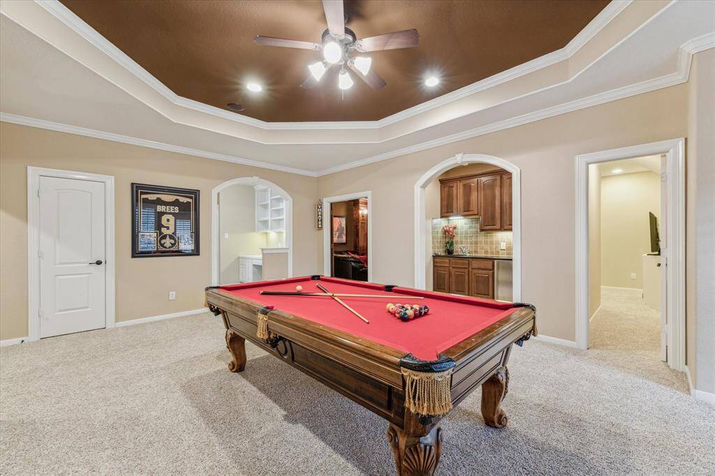 Tray ceiling with surround sound and a desk area just off the gameroom