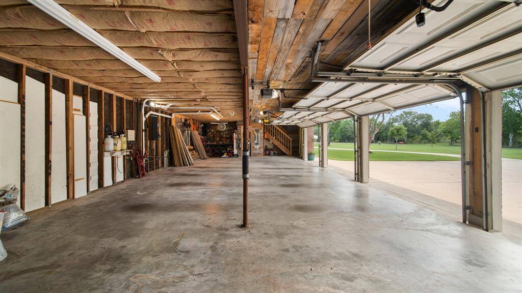 4 Car Detached Oversized Garage with TWO Upstairs Apartments.  Lots of Room for a Workshop & Storage.