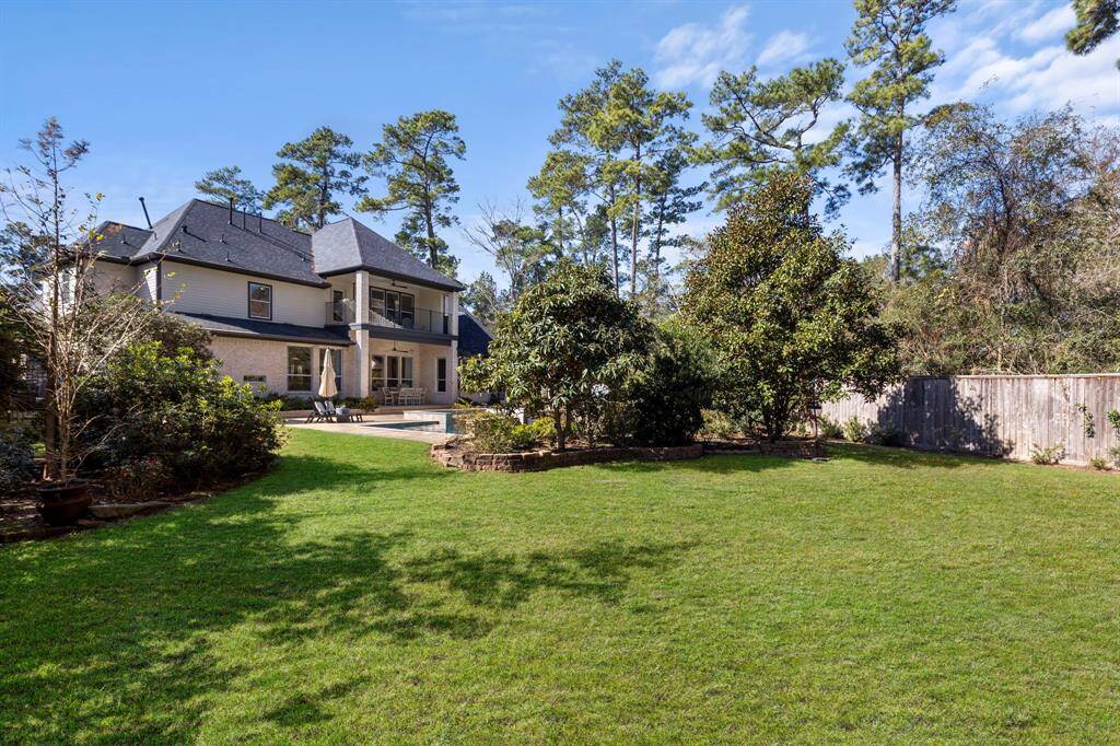 Imagine what you can do with all that space in this private, lush backyard! The possibilities are endless, whether it's relaxing in the serene surroundings or creating your own outdoor haven.