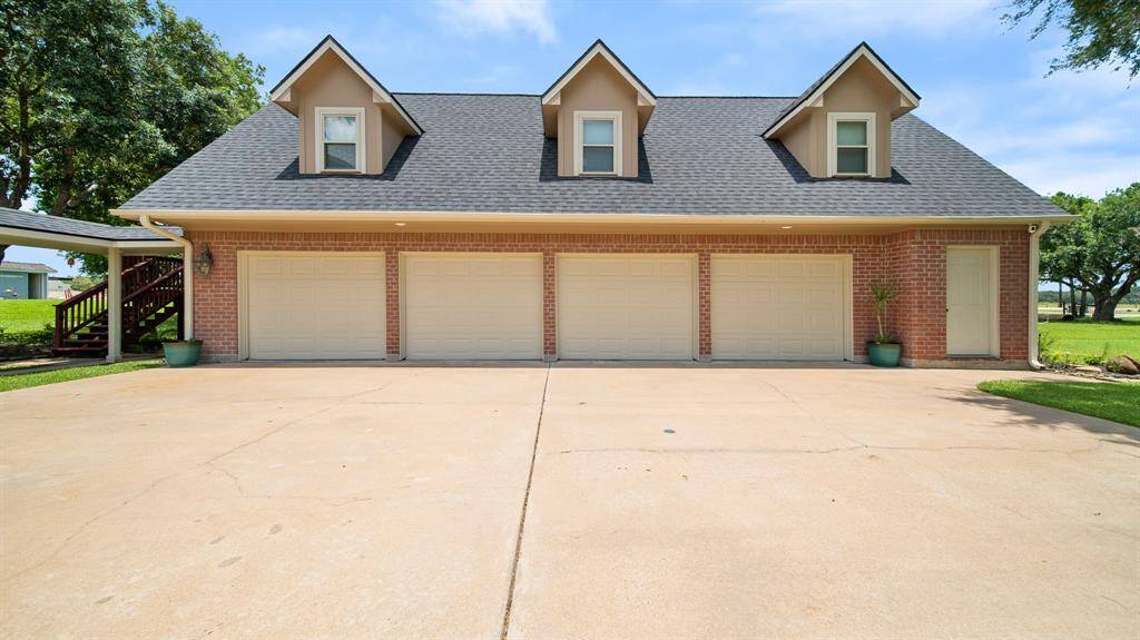 4 Car Detached Garage has a HALF BATH for easy outdoor access. 2 Upstairs Garage APARTMENTS with their own Separate Entrances.
