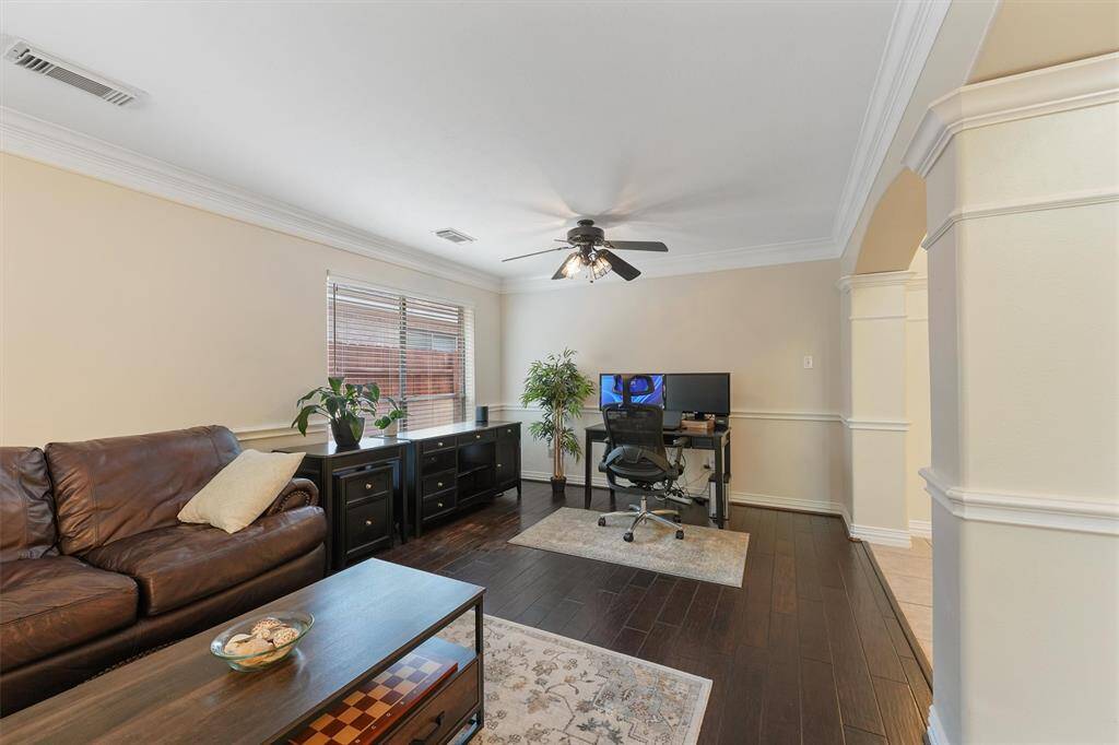 This living/dining area features hardwood flooring, a large window for plenty of light.