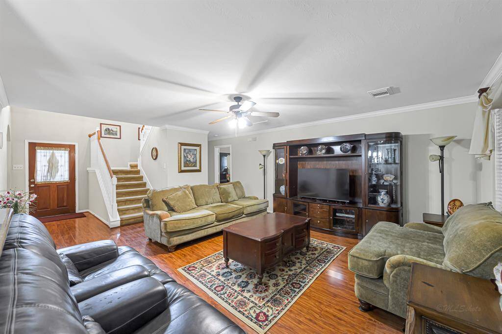 Welcome in! As you step inside, youwill be captivated by living area that features wood flooring, decorator paint, crown molding and more!