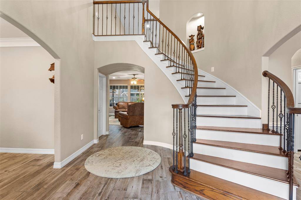 Front staircase off the entry, 2nd private staircase behind kitchen.