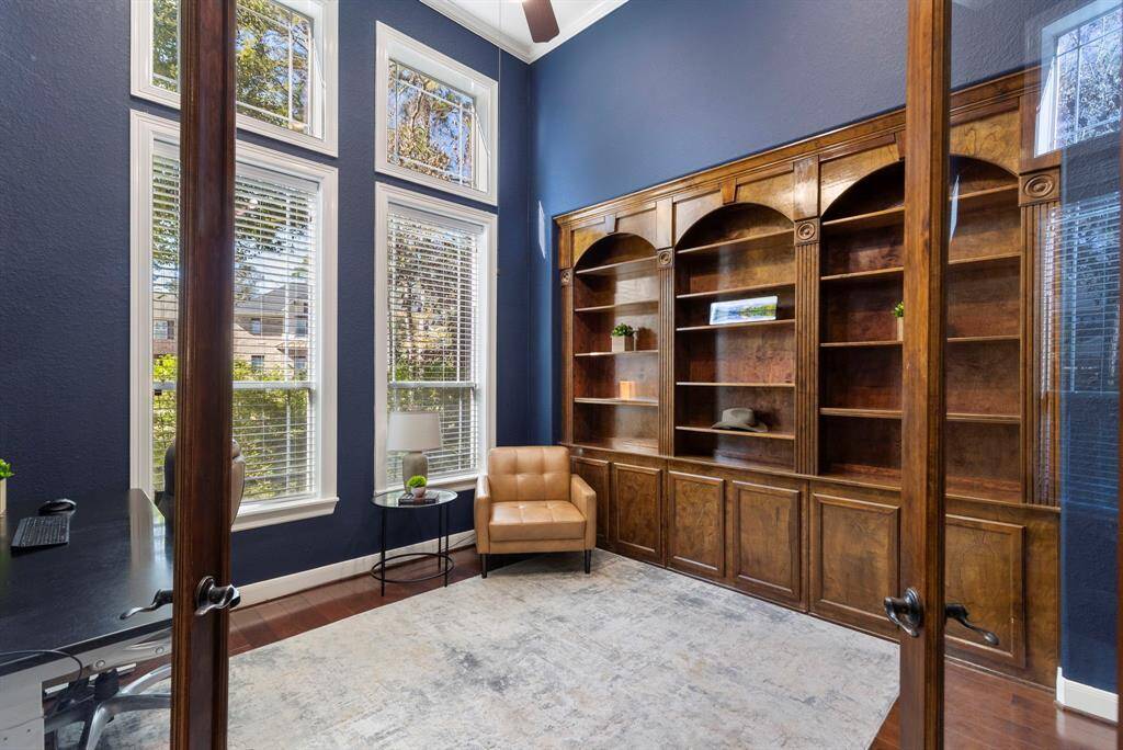 The handsome study is the ideal space for productive days, featuring a beautiful bookcase that adds both function and style. The double glass doors offer privacy, creating a peaceful environment for work or focused tasks.