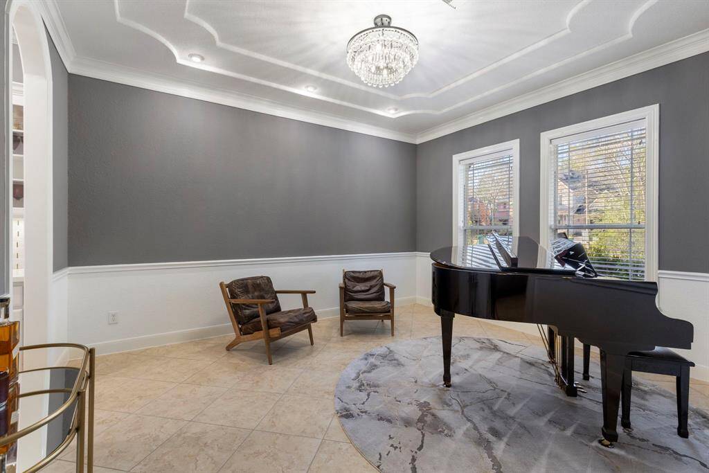 As you enter the home, to your right is the formal dining room, currently being used as a piano room. This space offers both versatility and elegance, easily adaptable to fit your preferences. The home is also equipped with surround sound throughout, ensuring a high-quality audio experience in every room.