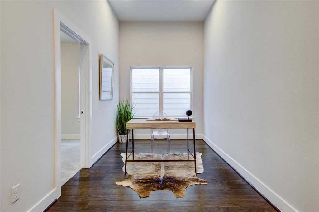 This dedicated home office space is perfect for remote work or study, offering a quiet and comfortable environment. With plenty of natural light, sleek furnishings, and ample workspace, this office ensures productivity and focus. The minimalist design and modern decor create an inspiring setting for any professional.