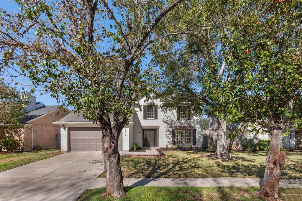 Charming two-story home. Features a spacious two-car garage and a well-maintained front yard with mature trees. Ideal for those seeking a cozy and inviting neighborhood setting.