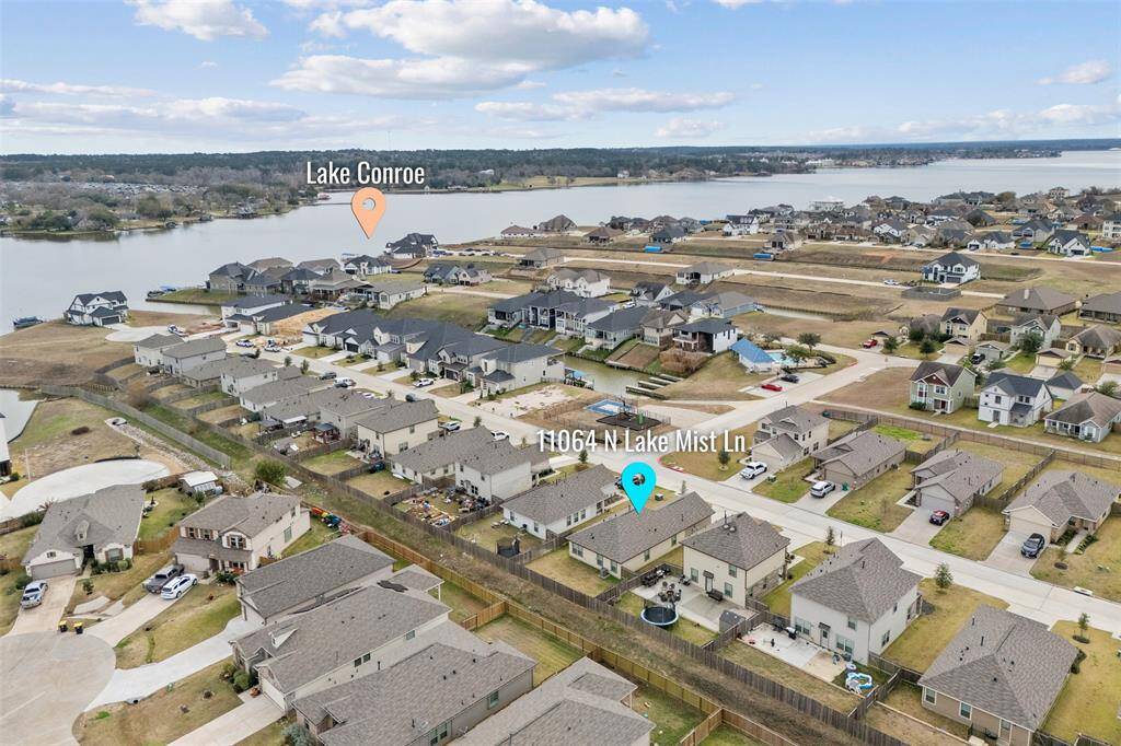 When we say lake front community, we mean it! Look how close the water is. Notice the boat launch between the park and the community pool right across from the home!