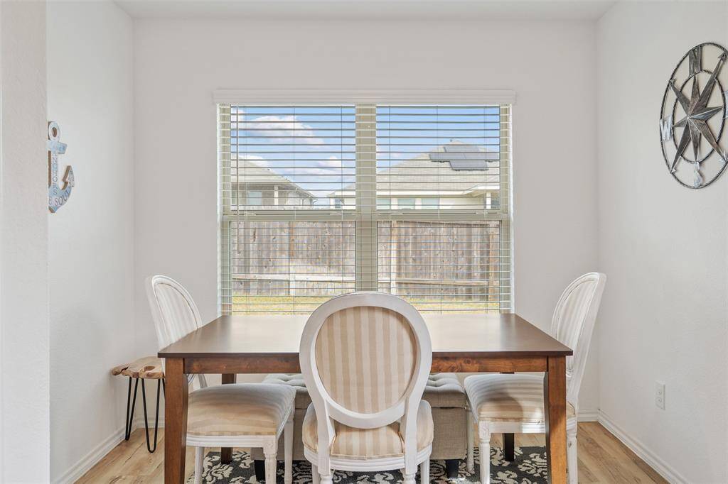 This dining area can easily fit a 6 person table with room to spare.