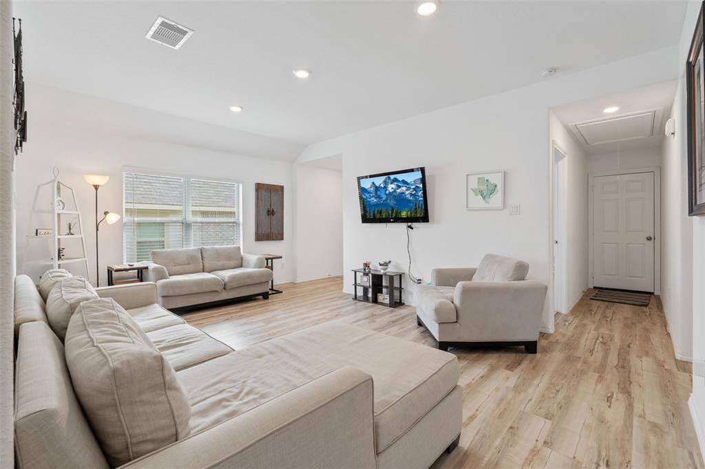 Down the hallway to the right are two bedrooms and a full bathroom. The door straight ahead leads to your two car garage perfect for vehicles or storing all of your fun toys.