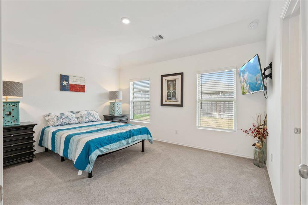 Look at this spacious primary bedroom. You have plenty of room to add additional dressers if you have one in your shopping cart ready to buy!