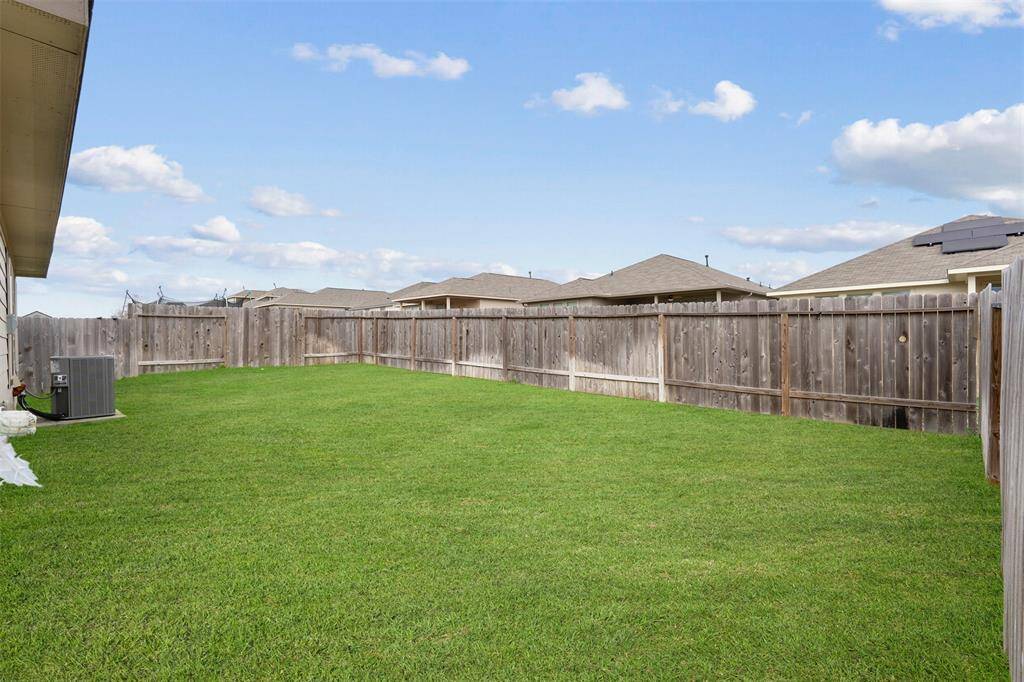Now it's time to see that backyard! From your back door, you can see Lake Conroe as you enter into your backyard.