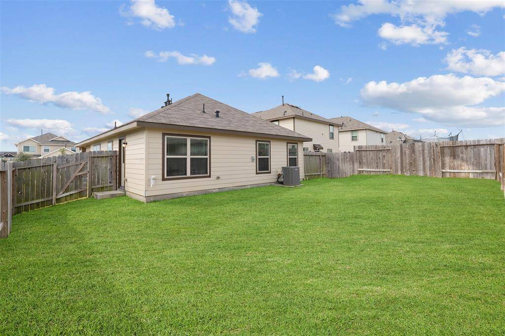 Here's another view showing how private your backyard is and a convenient gate for your mower.