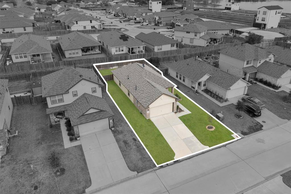 Here's a bird's eye view of the home showing the space between neighbors and the great sized driveway!