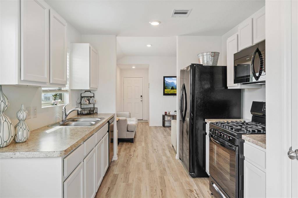 From here you can see your front door in front of you, your back door is to your left, your pantry to your right and your breakfast nook behind you. Talk about convenience!
