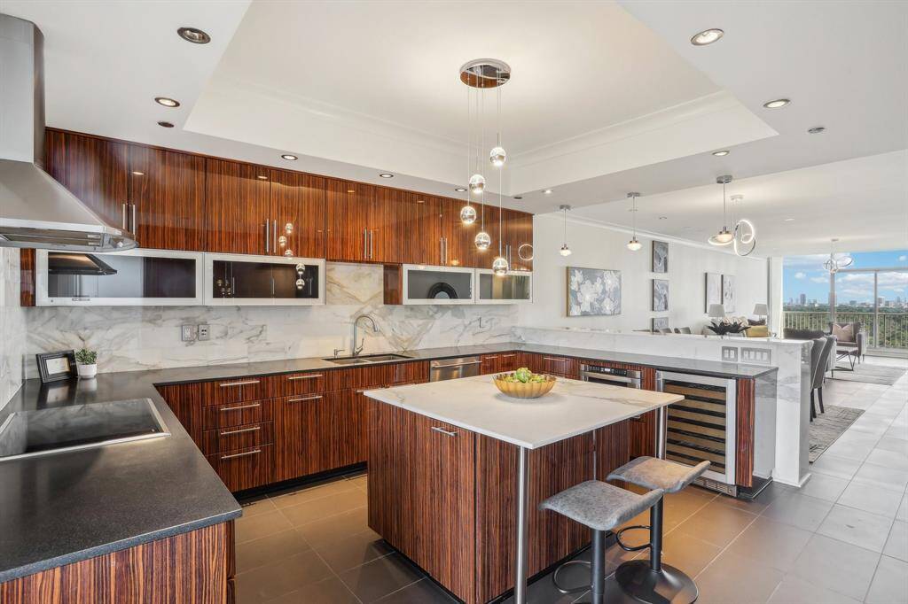 Kitchen with custom cabinets and marble countertops