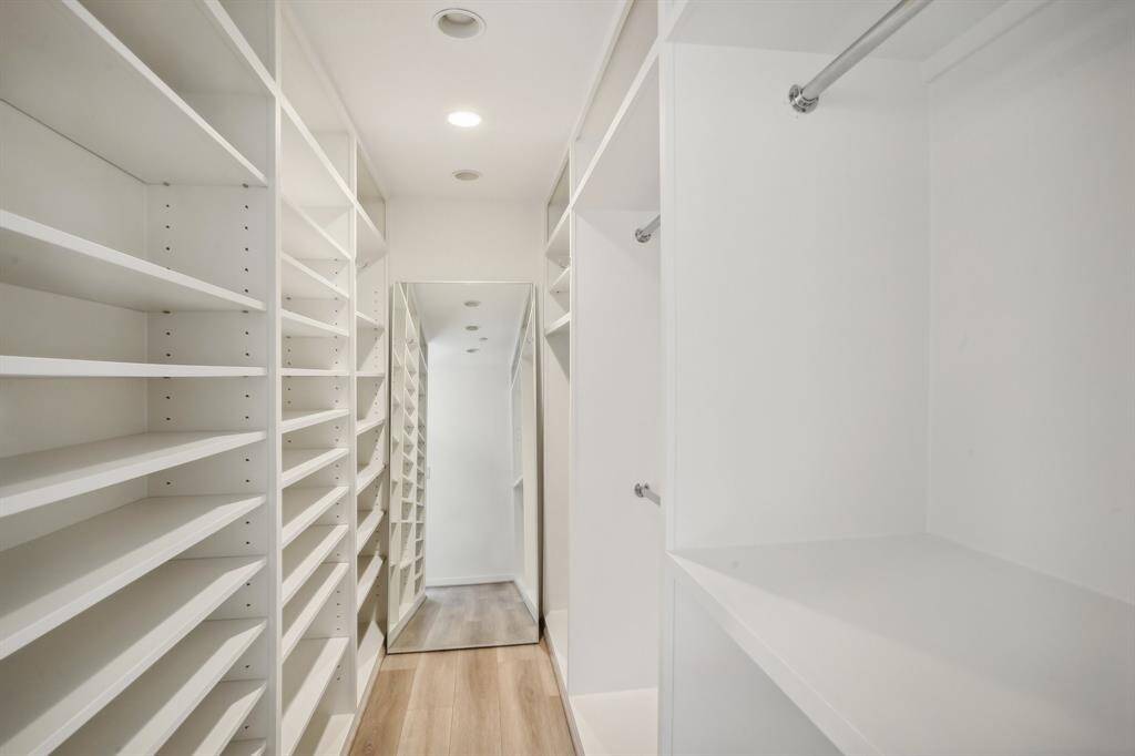 Custom closet in primary bedroom