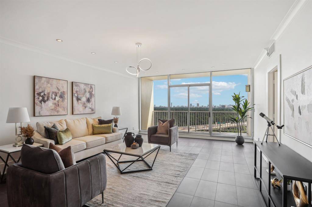 Living room with view of balcony overlooking downtown