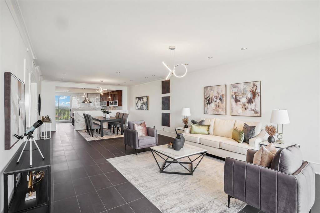 Living room with view into kitchen and dining