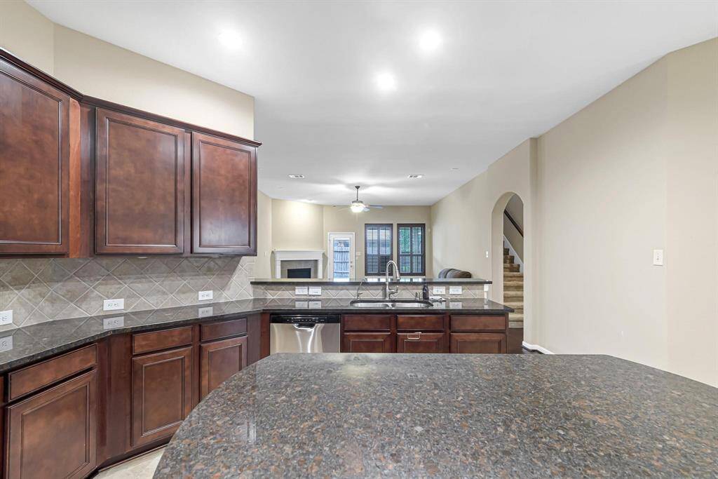 Sink overlooking the family room means you won't have to miss any of the action.