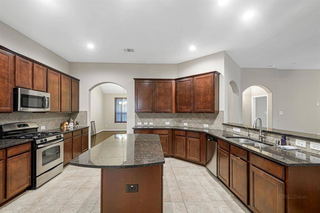Additionally this kitchen offers a gas range and built in microwave