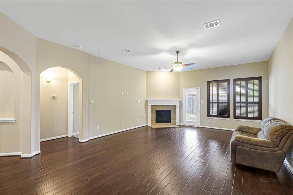 Family area with the fireplace for cool nights and ceiling fan for summer.