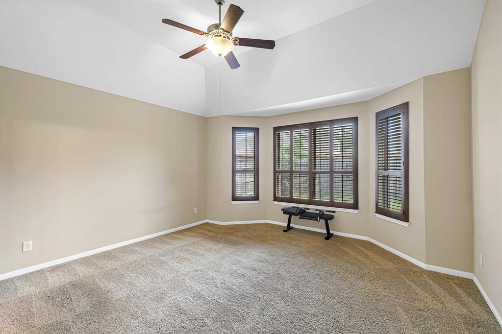 Spacious master suite with bay window overlooking the backyard.
