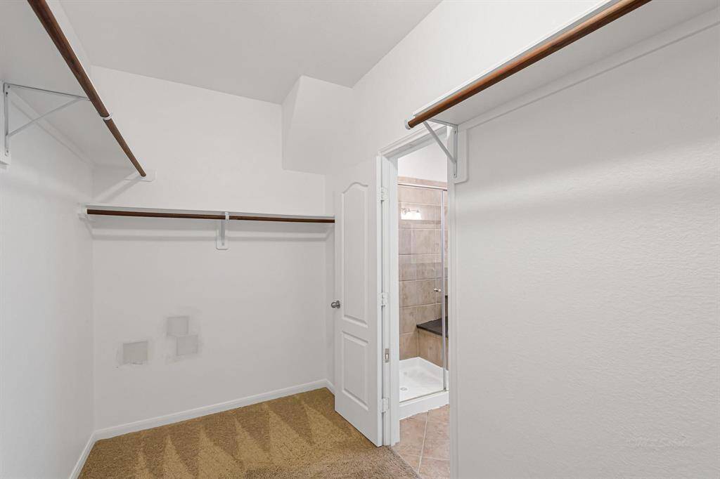 The large master closet is a dream space, plenty of room for all your shoes!