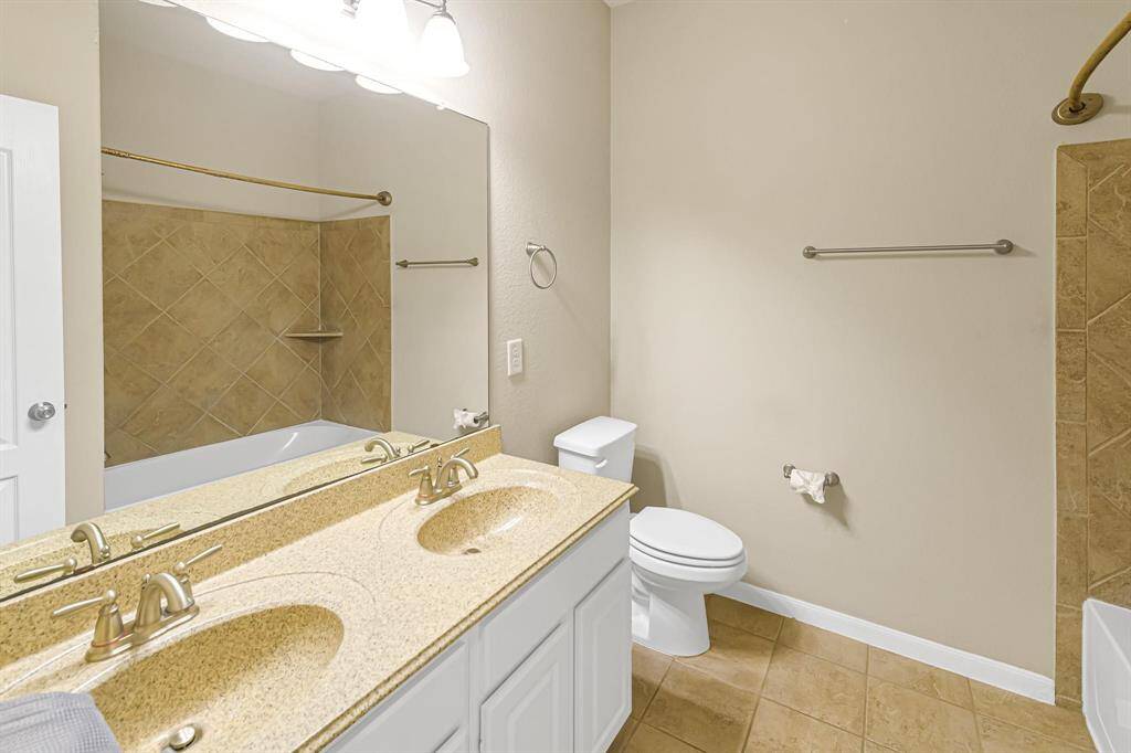 No more waiting for a bathroom to open up. Here is another secondary bath with duals sinks