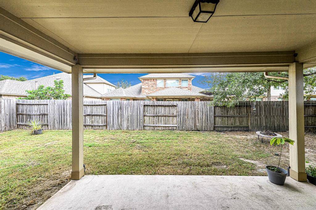 Covered patio in the back is the best place to unwind at the end of the day or BBQ on the weekends.