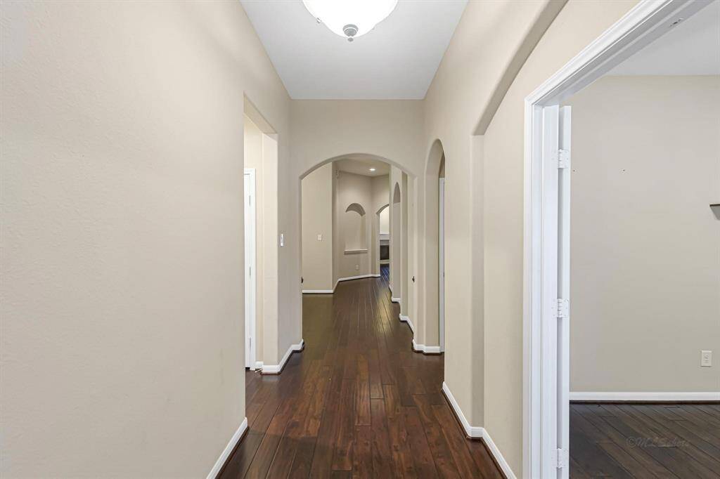 As you enter the home you will be greeted by rich engineered wood floors and high ceilings.