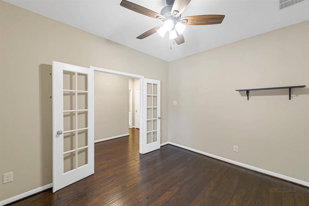 The French doors to the study provide privacy. This would also make a great playroom or nursery.