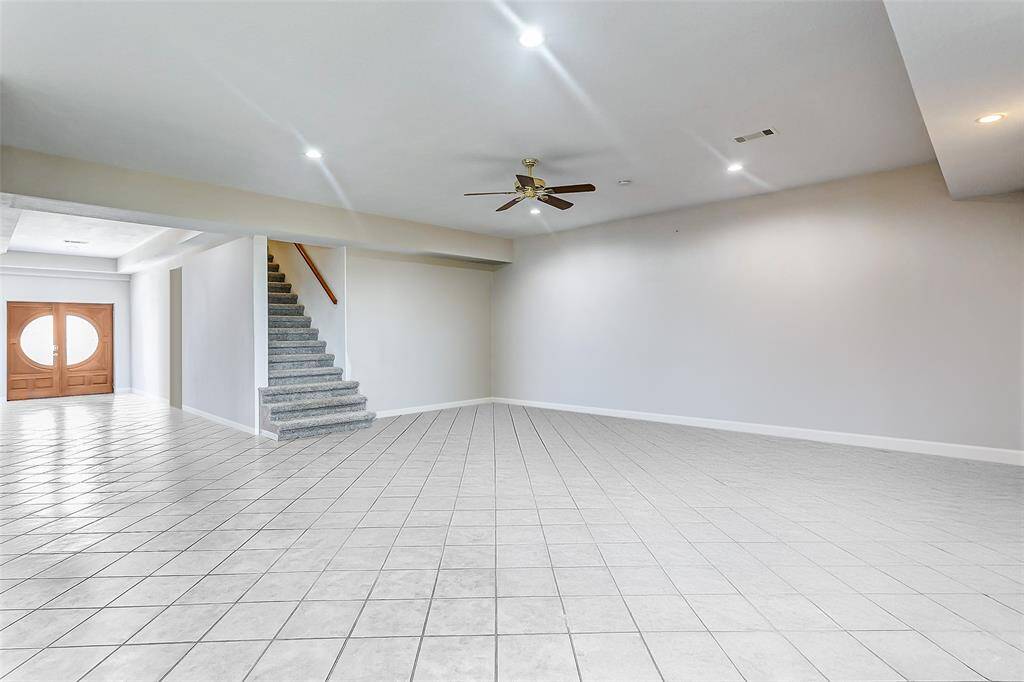 This spacious main living area features an open layout. Large windows bring in an abundance of natural light.