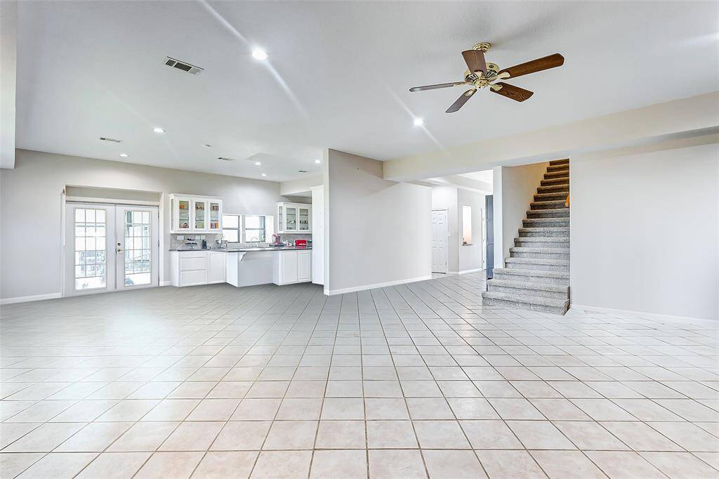 The main living space seamlessly flows into the kitchen and dining area, creating an open and functional layout.