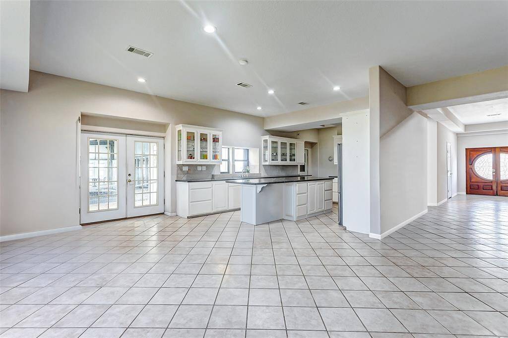 Bright open-concept dining and kitchen area.