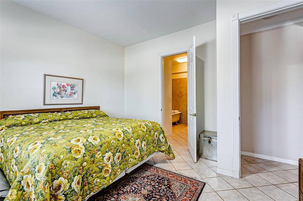 This spacious first-floor bedroom with a private ensuite ideal as a primary or guest suite.
