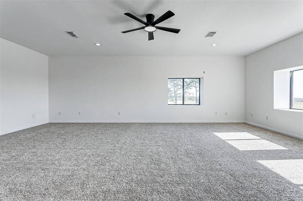 The sheer size of the second-floor primary suite offers incredible flexibility, with the potential to divide it into multiple rooms to suit your needs.