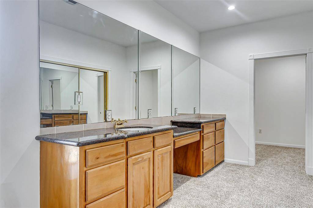 Sleek dual vanities with individual sinks combine style and functionality for your daily routine.