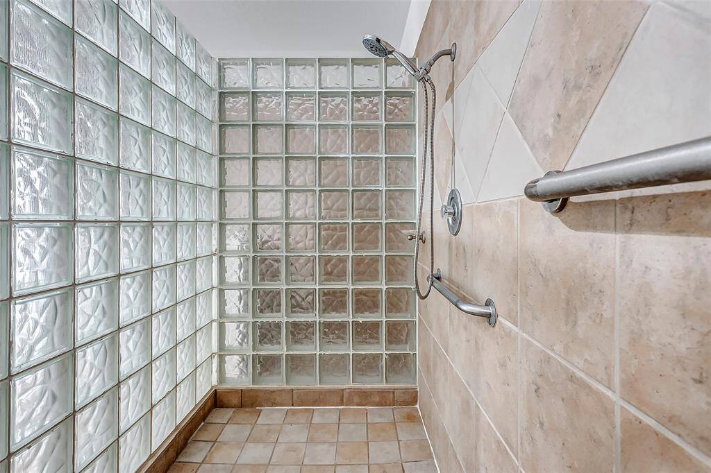 Walk-in shower with sleek glass block walls