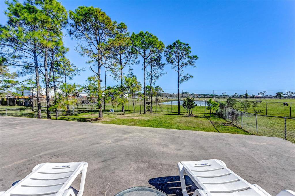 Ideal for pet owners, this home features a dedicated fenced area for pets to play safely.