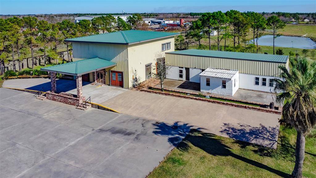 Climate-controlled 4-car garage with a 3,000 sq. ft. carport—perfect for vehicle enthusiasts.